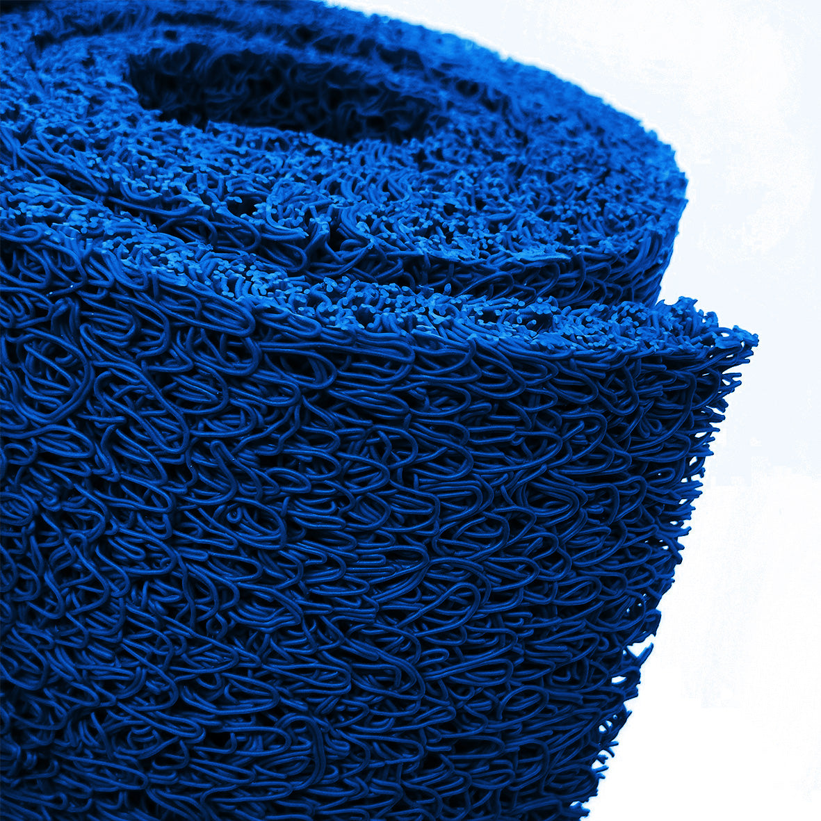 Close-up of a roll of blue spaghetti mat on a white background