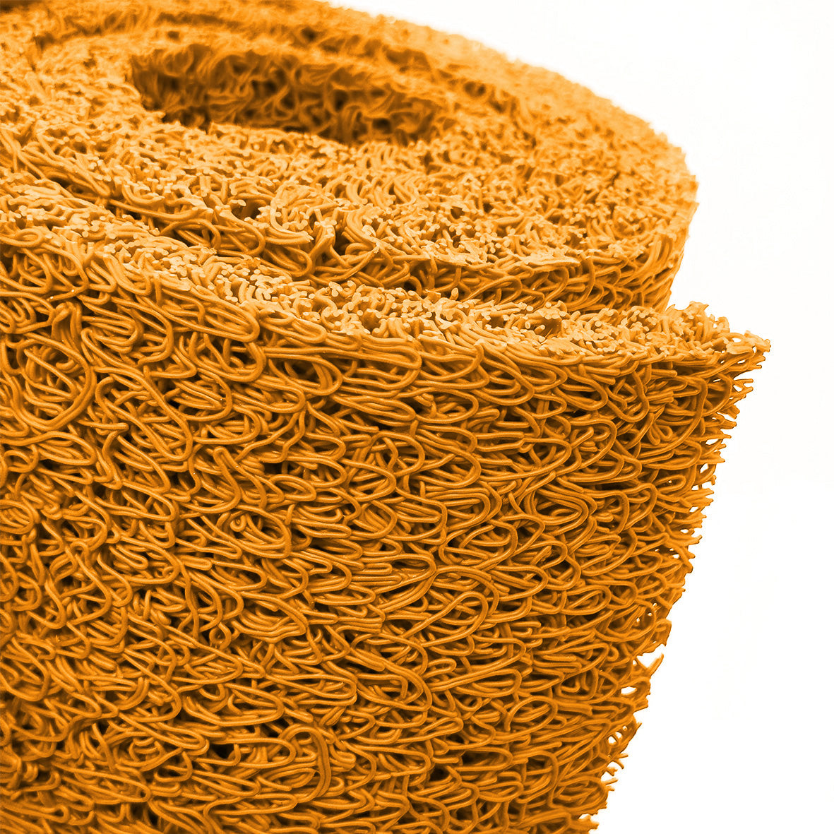 Close-up of a roll of orange spaghetti mat on a white background