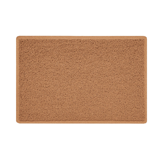 A beige indoor spaghetti door mat with a textured design and a non-slip rubber base.