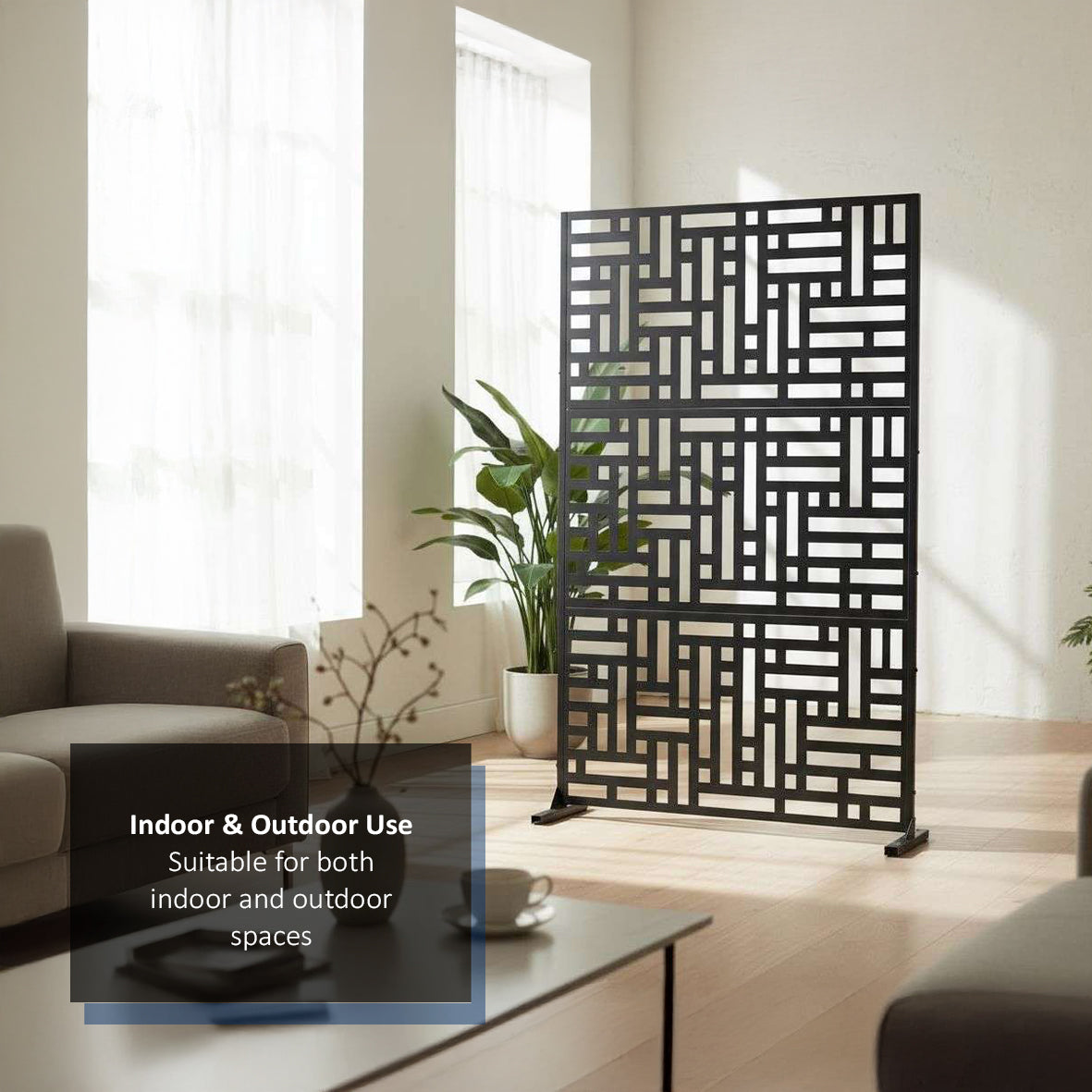Black metal privacy screen in a living room with text indicating indoor and outdoor use.