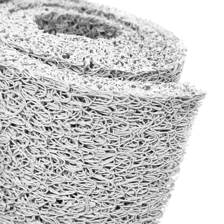 Close-up of a roll of spaghetti mat on a white background