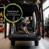 Person installing the 4mm thick rubber floor mat in a van with text 'Can Be Cut to Fit' displayed.