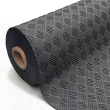 Close-up of a black rubber matting roll with a textured checker-plate pattern, partially unrolled on a white background.