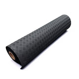 Black Eco Deckplate rubber flooring roll with a textured checker-plate pattern, isolated on a white background.