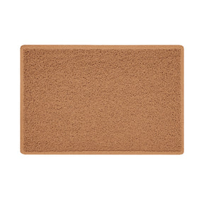 A beige indoor spaghetti door mat with a textured design and a non-slip rubber base.