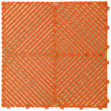 Orange interlocking garage floor tile with a ventilated diamond pattern, top-down view on white background.